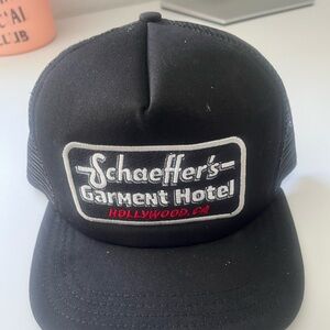 Schaeffer's Garment Hotel Black Trucker Hat